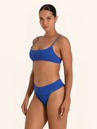 Women’s royal blue swimwear bikini top with adjustable straps.