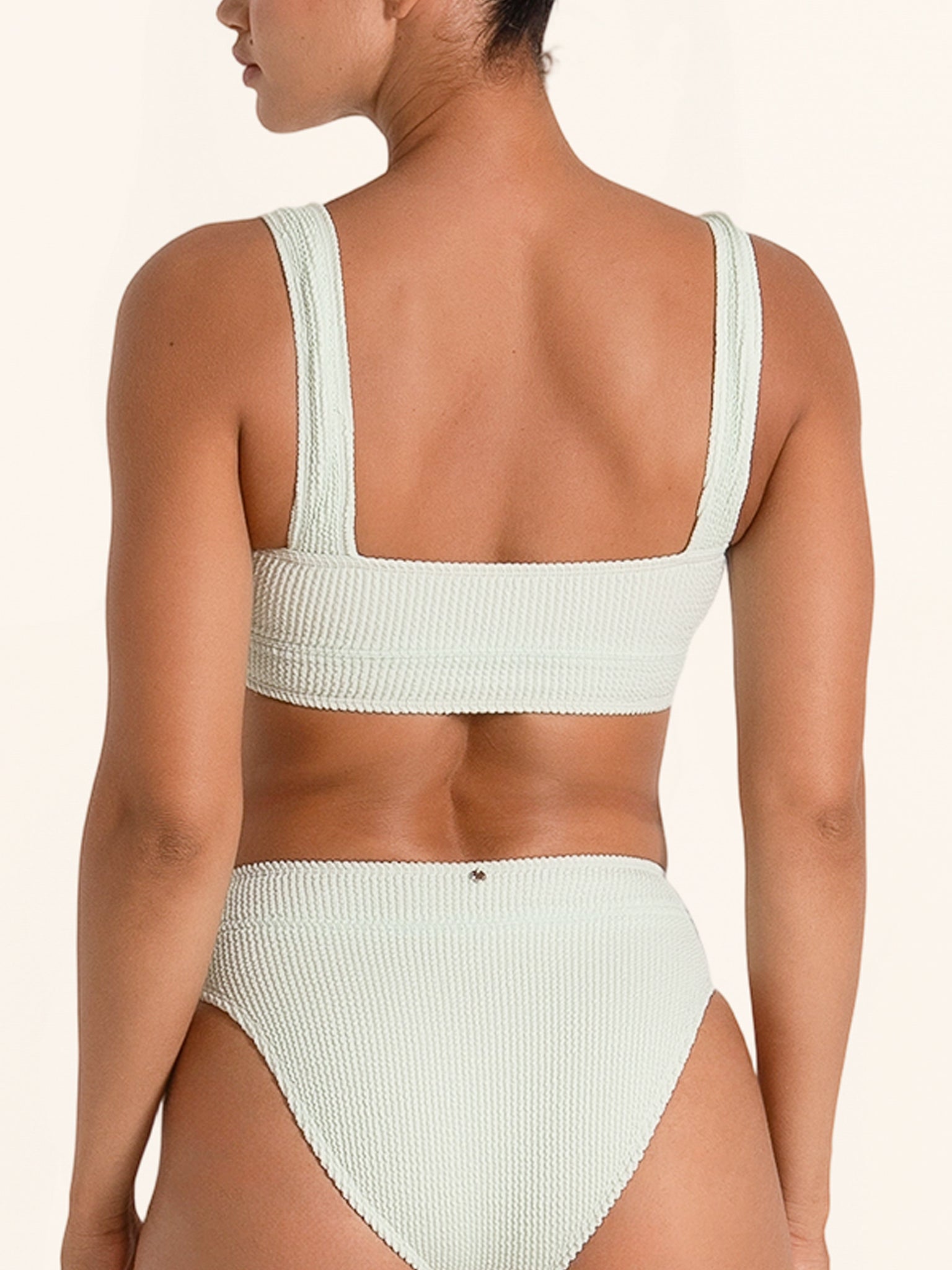Sage green sporty bikini top with modern square neckline.