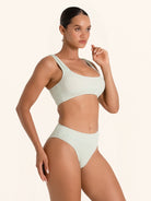 Soft green bikini brief with ribbed fabric and high waistline.