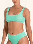 Women’s mint bikini top in square neck design with wide straps.
