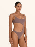 Textured brown cut out swimsuit with high leg and ring accent.