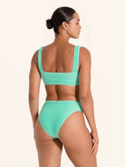 Textured mint bikini top featuring thick straps and secure fit.
