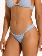 Baby blue textured bikini set with triangle top and low rise side tie bottom