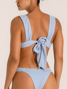 Textured baby blue bikini set with model showing back and side pose