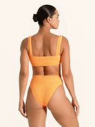 Vibrant orange textured bikini top with a sleek silhouette.