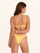 Vibrant mustard yellow bikini top with sexy flattering fit.