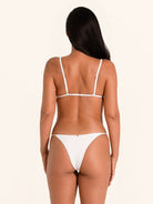 White adjustable side tie bikini bottom with low rise fit.