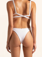 Back view of white bikini bottom with cheeky coverage and clean finish.