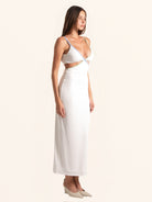 Side angle view of white evening maxi dress with slit