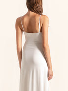 Closeup back of white midi dress with thin adjustable straps
