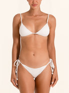 White tie side bikini bottom with ribbed textured fabric and adjustable strings.