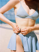 A Girl wearing Baby Blue Bikini Top With Mini Cover Skirt- OCEAN MYSTERY