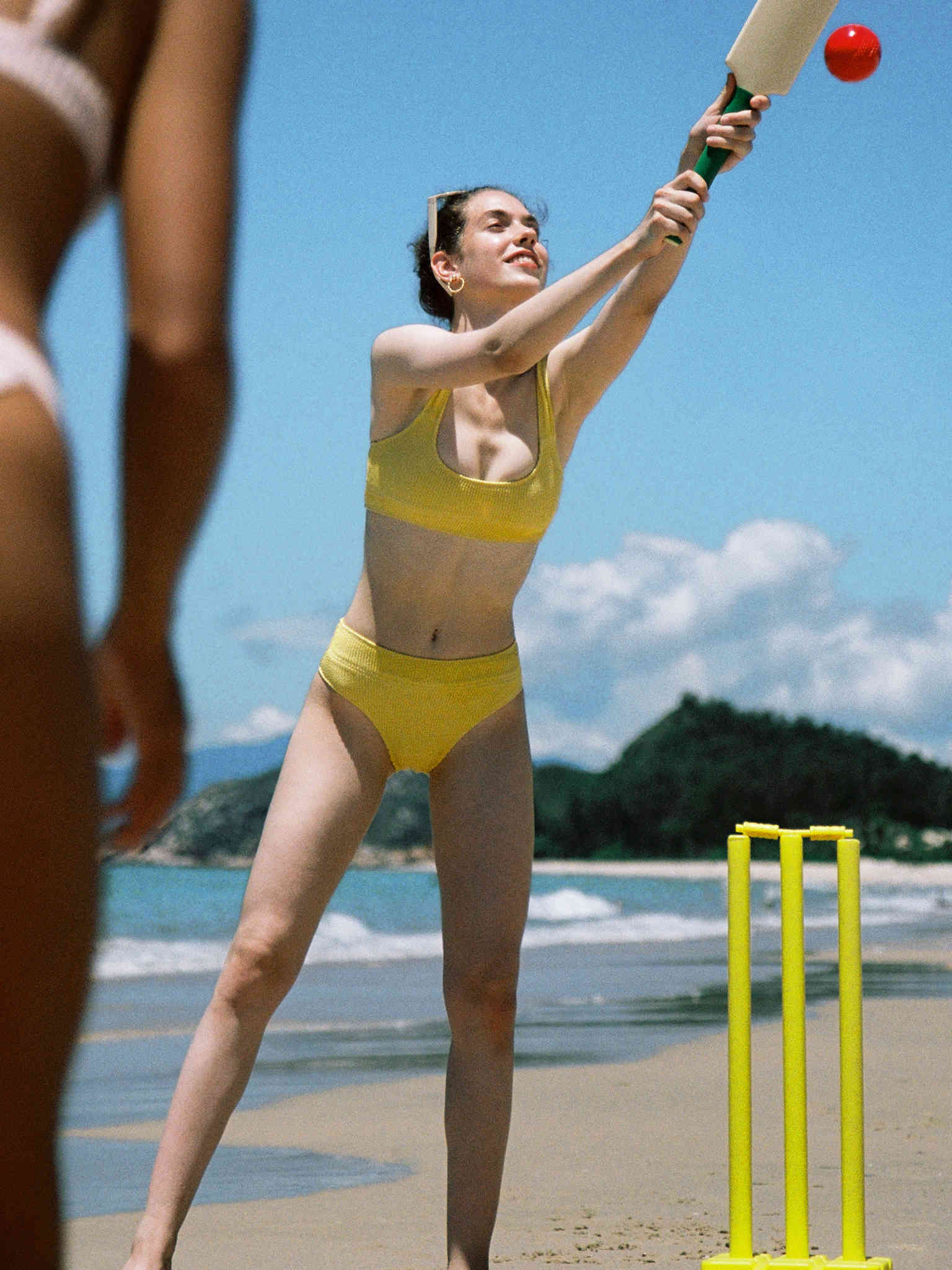 A Girl Wearing High Waisted Bikini Set Playing Sport
