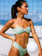 A Girl in a Mint Green Strapless Bikini holding a volleyball - OCEAN MYSTERY