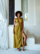 Mustard Yellow High-Slit Dress with Symmetrical Cutouts and Halter Tie Neck
