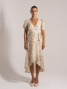 Ocean Mystery floral wrap dress with V-neck, puff sleeves and asymmetrical high-low hem - feminine summer style.