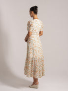 Ocean Mystery white floral maxi dress with ruched waist - back view with wedge heels for summer.