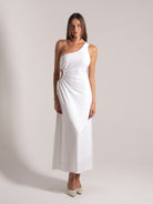 Ocean Mystery white one-shoulder maxi dress with side cutout - floor-length elegance with cream heels.