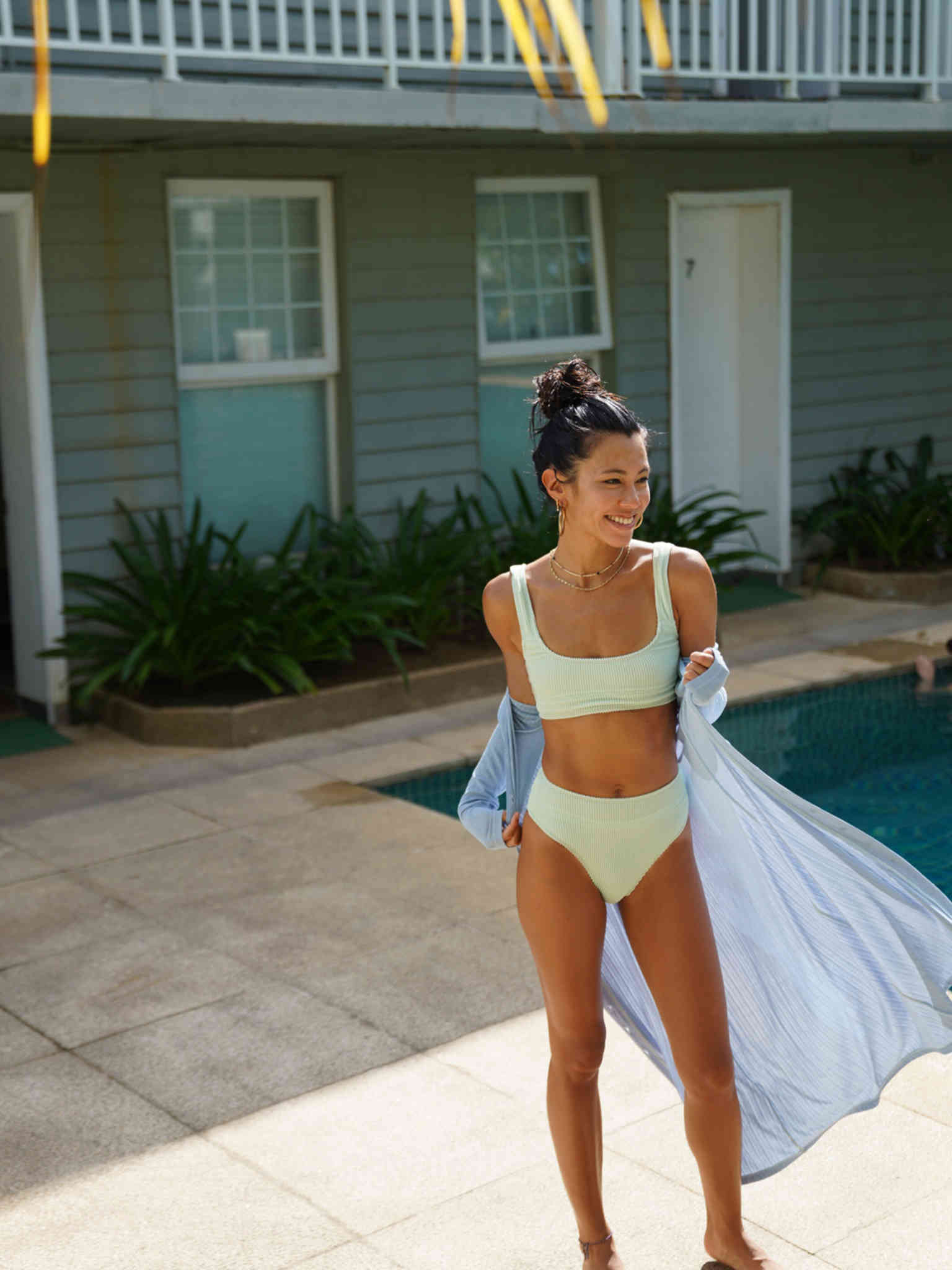 A Girl Wearing Tankini Set On Pool Side