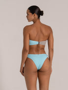 Backless bikini with aqua and gray ribbed texture, highlighting sleek design and toned silhouette.