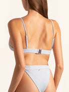 Back view of baby blue ribbed bikini top with adjustable straps and clasp closure.