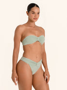 Light green bandeau swim bottom with sleek high-waist silhouette.