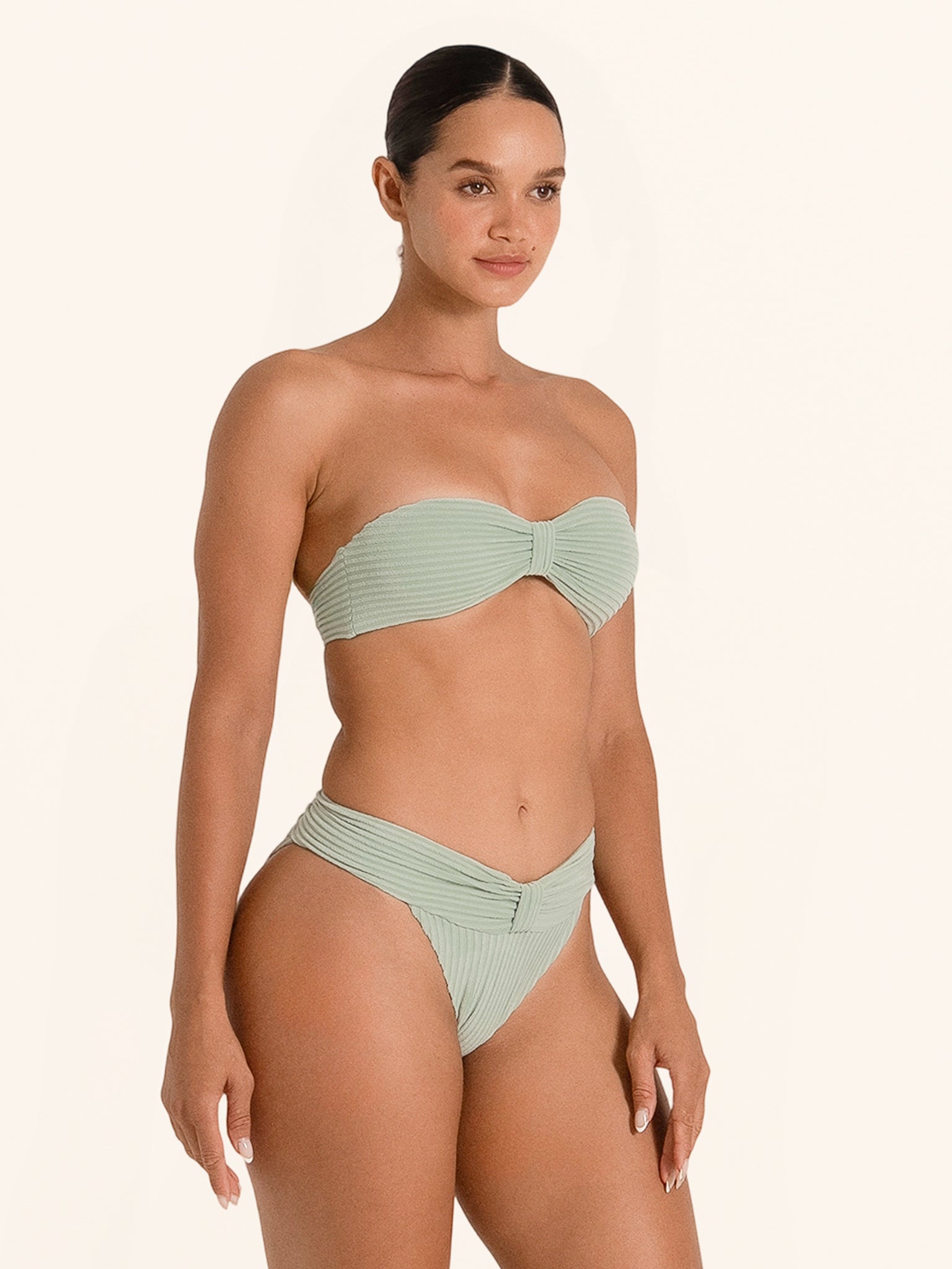 Light green bandeau swim bottom with sleek high-waist silhouette.