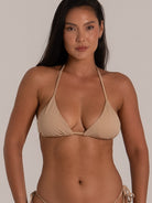 Front close-up of beige triangle bikini top with minimal coverage and halter ties