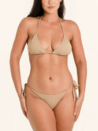 Minimal beige tie side bikini bottom with adjustable strings.