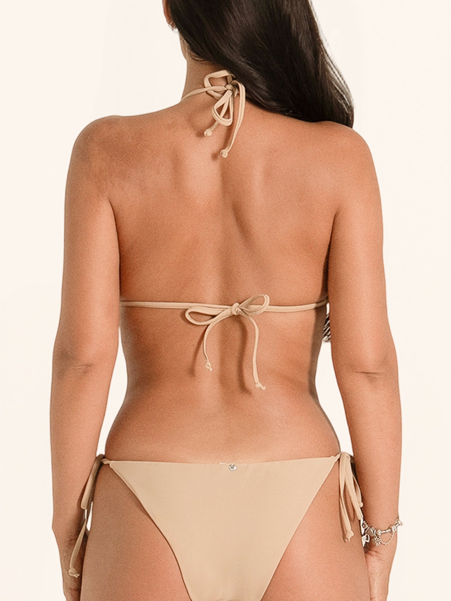 Minimal beige triangle bikini top with halter neck ties.