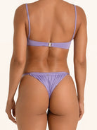 Back view of purple bikini bottom with cheeky thong cut and sleek fit.