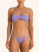 Front view of purple bikini bottom with minimal coverage, styled with matching bandeau top.