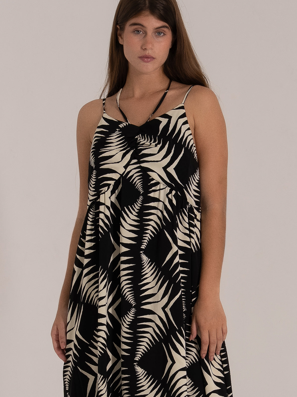 Black and beige halter neck midi dress with bold leaf print and relaxed fit