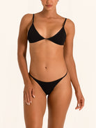 Front view of black bikini bottom with minimal coverage and sleek low rise fit.