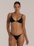Full front view of black triangle bikini top on model with minimal design