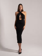Front view of black halter crisscross cutout midi dress