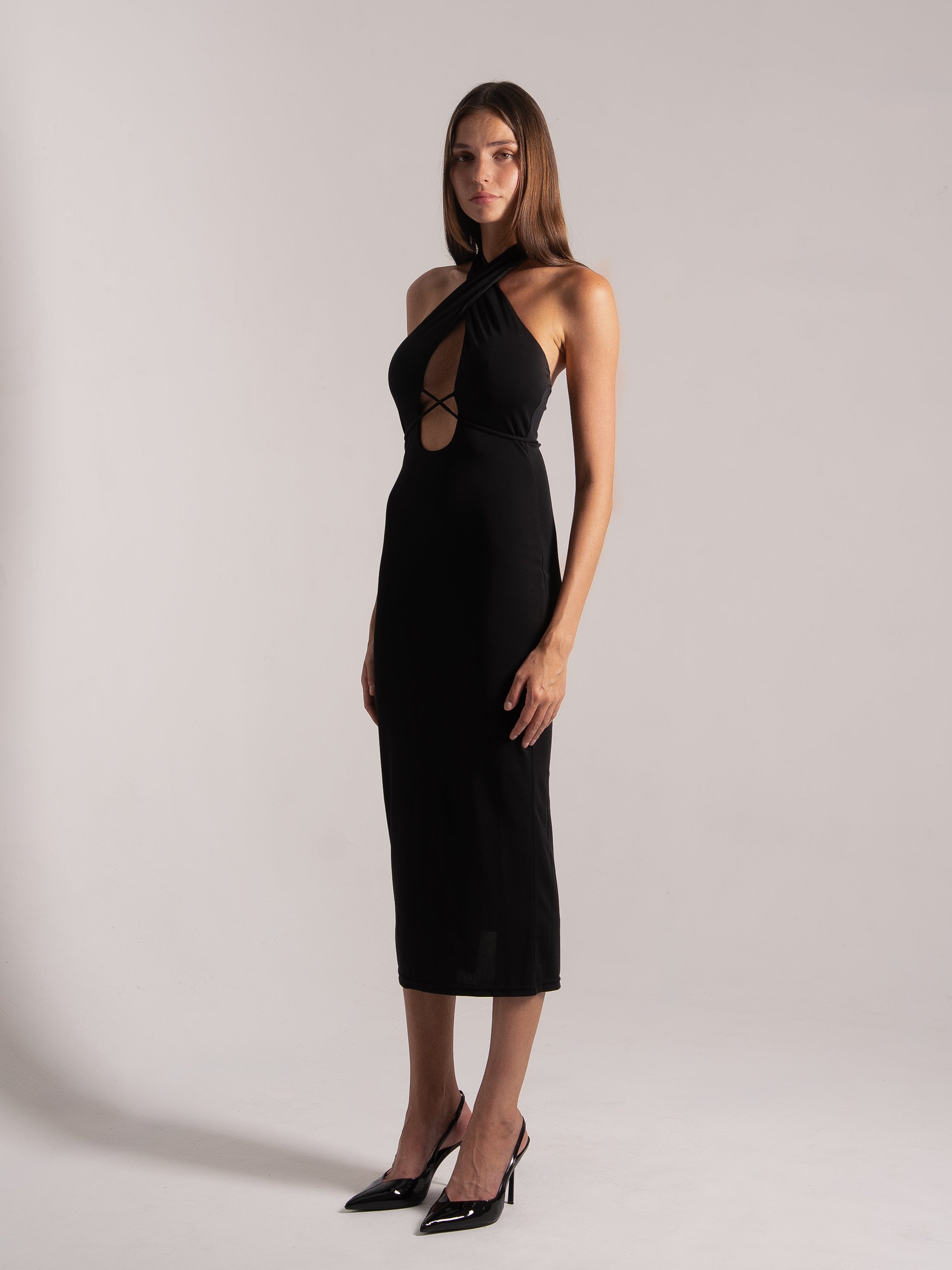 Quarter view of black halter crisscross cutout midi dress