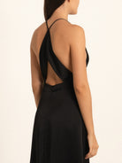 Back view of black maxi dress with open back and crisscross straps
