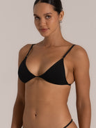 Close-up front view of black textured triangle bikini top with deep neckline