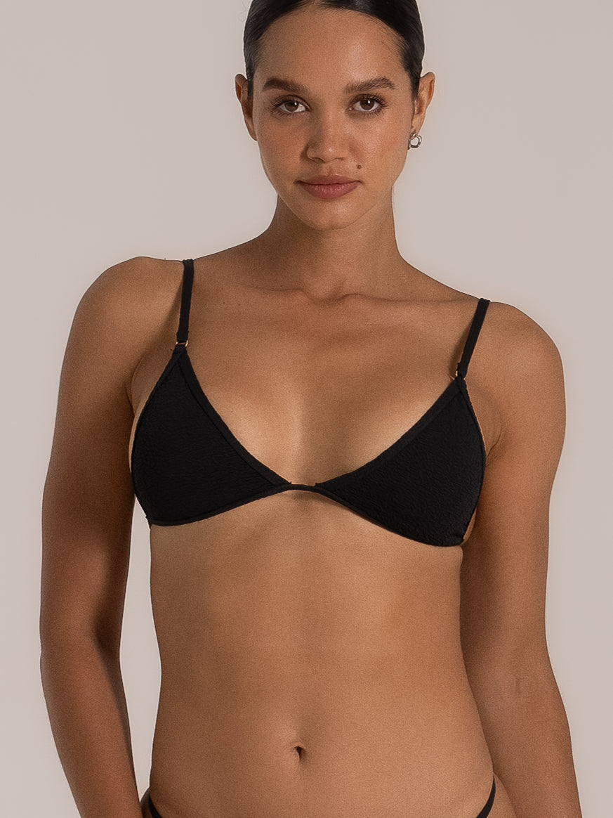 Front detail of black triangle bikini top with adjustable straps
