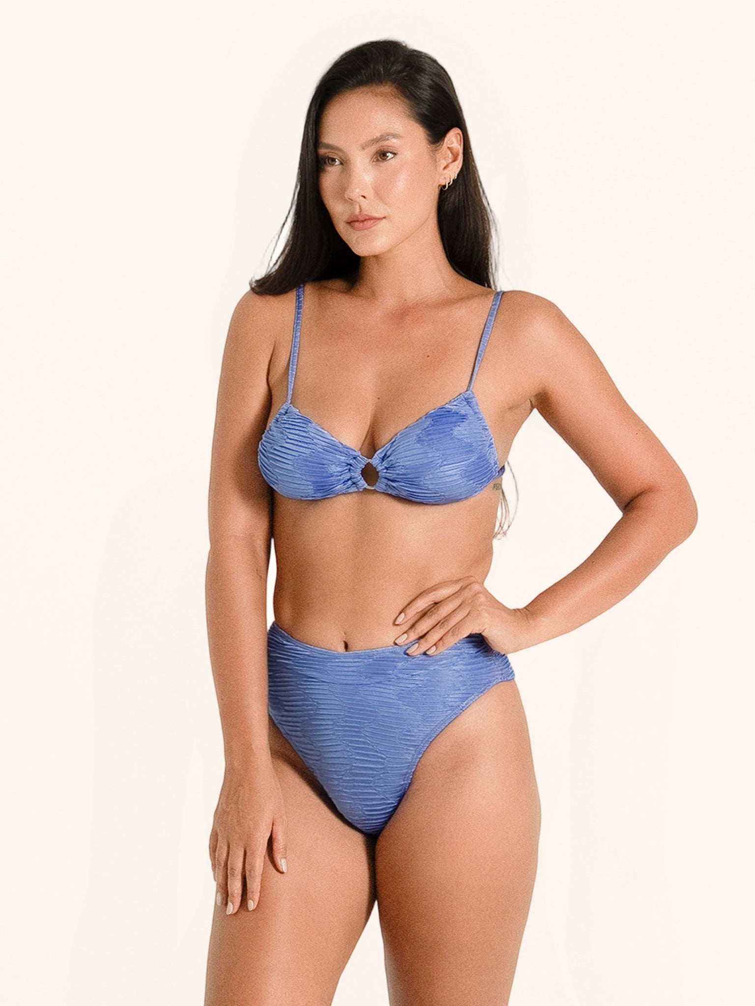 Blue bikini bottom featuring textured fabric, high leg cut and medium coverage.