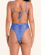 Blue textured bikini bottom with high leg cut and moderate coverage.