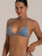 Side angle view of a blue-grey textured triangle bikini top with thin straps.