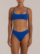 Full front view of blue textured bikini set with scoop neck top and high waist bottom
