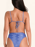 Blue swimwear bikini top with soft cup design and tie back fastening.