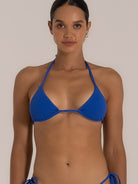 Front close-up of a royal blue triangle bikini top with adjustable neck and back ties