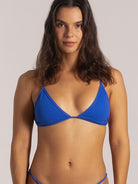 Close-up front view of blue triangle bikini top with adjustable straps
