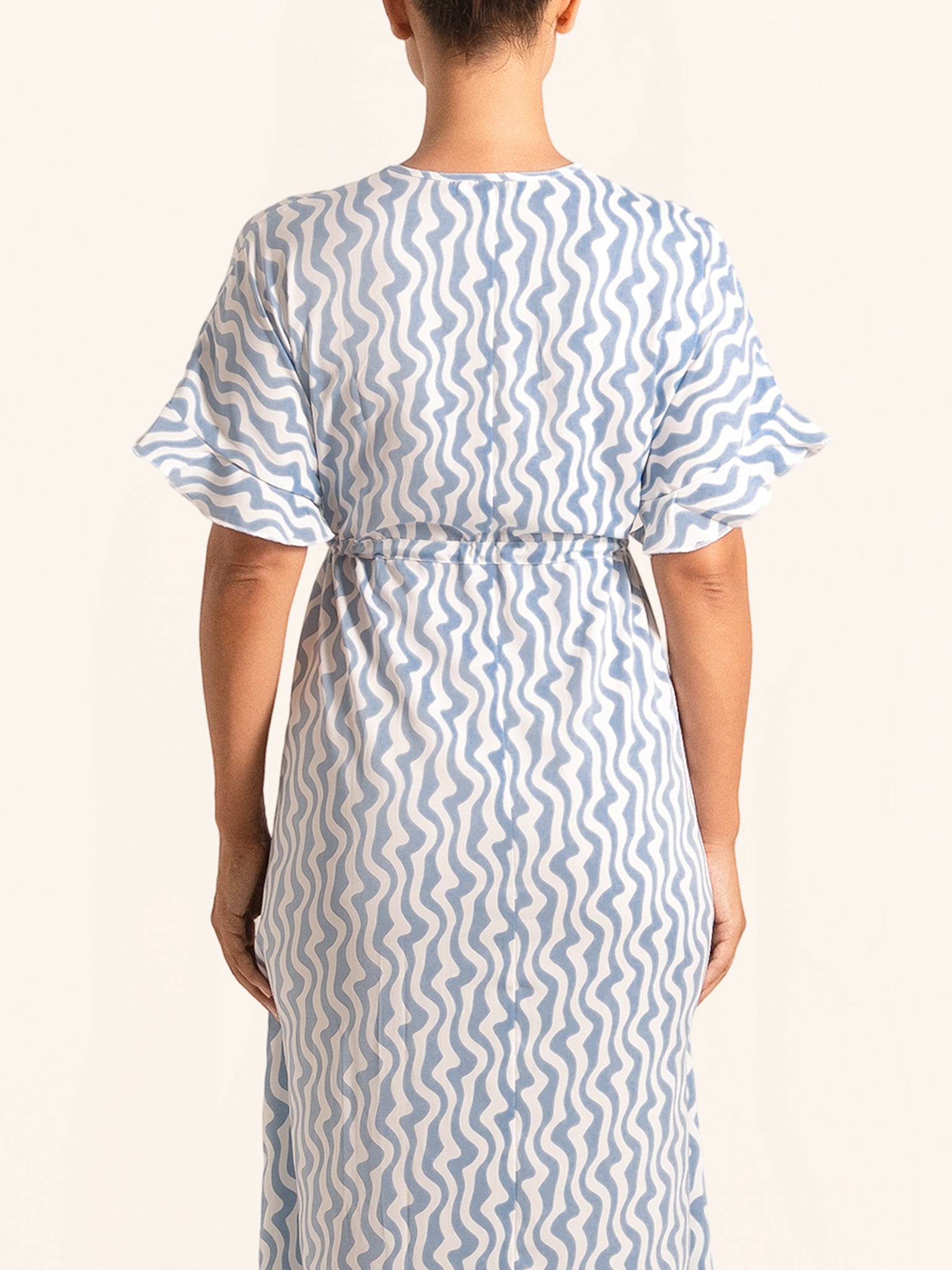 Back view of blue and white printed maxi dress with relaxed silhouette