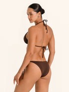 Minimal coverage brown string bikini bottom featuring side ties.