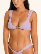 Close up of lilac textured bikini bottom showing flattering cheeky cut and soft fabric.
